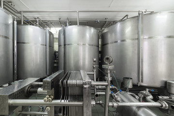 Industrial equipment, metal tanks in the liquor factory.