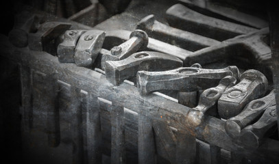 Collection of vintage woodworking tools on a rough workbench