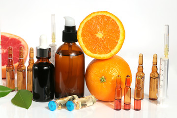 Vitamin C and Mesotherapy. Serum with vitamin C in ampoules, syringes and brown glass bottles,...