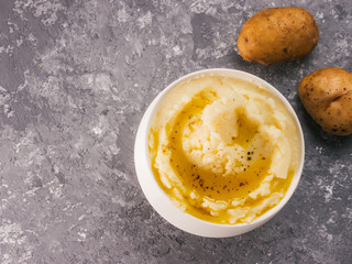 Mashed potatoes on gray concrete background