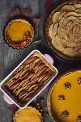 Autumn background. Homemade Pumpkin, apple Pies for Thanksgiving Ready to Eat.