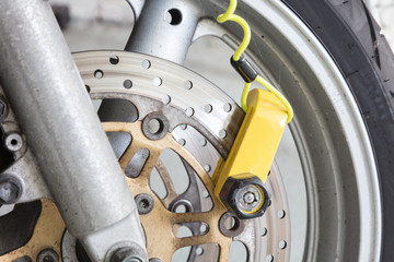 Security lock blocking the motorcycle wheel
