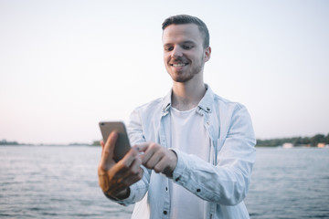 A guy with a phone in park