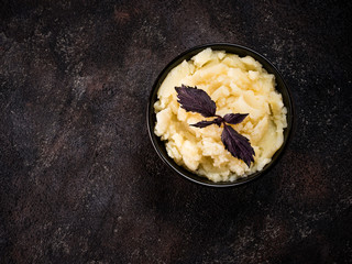 Mashed potatoes on dark concrete background