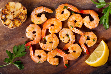 grilled shrimps on a wooden board