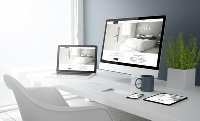 Fototapeta na wymiar grey studio devices with hotel website