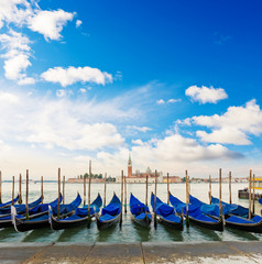 Fototapeta na wymiar Gondolas moored by Saint Mark square. Venice, Venezia, Italy, Europe
