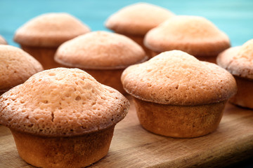 Fresh muffins on a blue wooden table. Copy space. Top Views