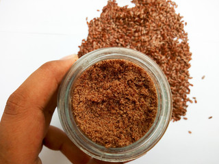 Grounded flaxseeds holding in jar 