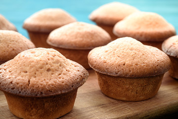 Fresh muffins on a blue wooden table. Copy space. Top Views