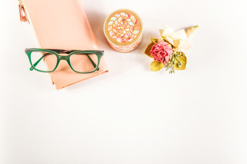 pink flowers,green glasses and pink purse,golden box.White background.Flat lay, top view.Copy space for text.women's accessories.