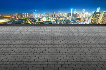 empty floor with cityscape of hangzhou in blue cloud sky at twilight