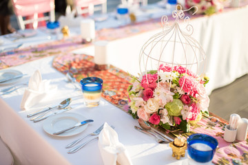 Table setting at a luxury wedding and Beautiful flowers on the table.