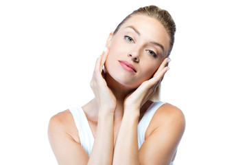 Beautiful young woman looking at camera over white background.