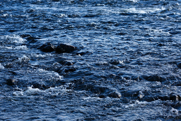 Obraz premium Rapid stream of a mountain river