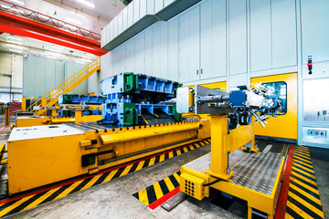 robots welding in a car factory