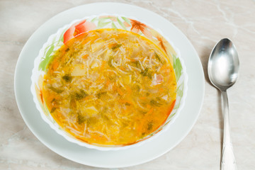 Homemade soup on a marble table closeup