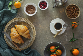 Breakfast with coffee and croissants