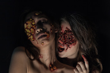 Girls with a realistic Halloween makeup. Girls with sores and blood on their face. - obrazy, fototapety, plakaty