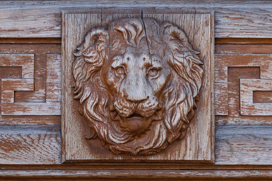 Lion head relief on the facade