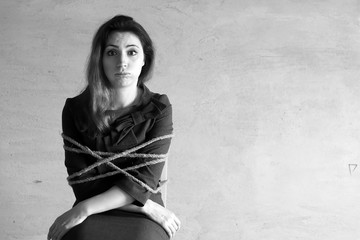 monochrome photo of a business woman sitting on chair associated workaholic concept