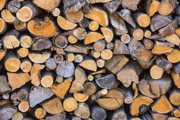 Abstract view on stacked or piled fire wood.
