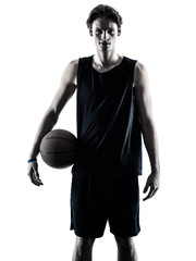 Fototapeta premium one caucasian basketball player man isolated in silhouette shadow on white background
