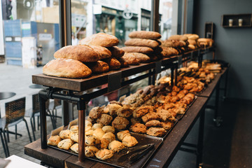 Fresh Bread and Pastries Displayed in Bakery Window in Copenhagen City Center Denmark