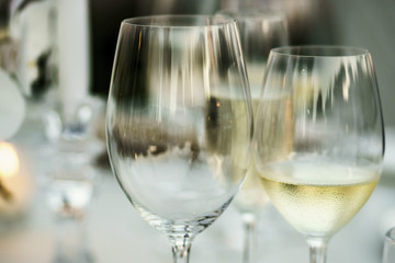 Empty wineglass and glass with white wine