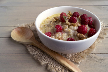 Breakfast with oatmeal and fresh raspberries.