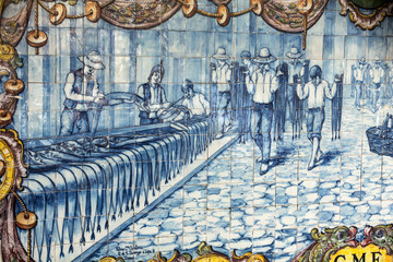  Traditional ceramic tiles in  Funchal on Madeira depicting local life.