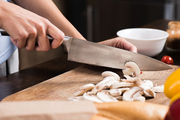 woman cutting mushrooms