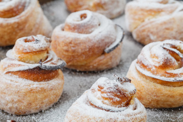 Modern fashionable pastries - scones cruffins (puffmaffin), a mixture of a croissant and maffin