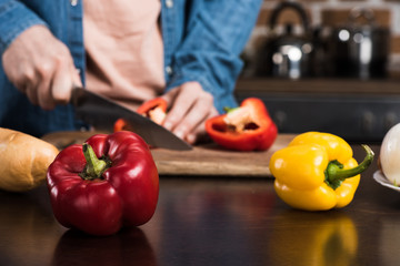 man cutting pepper
