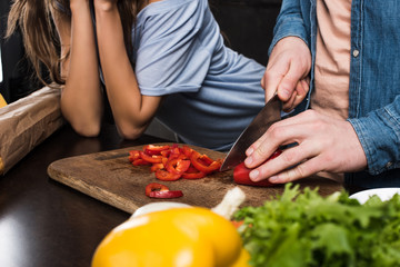 man cutting pepper