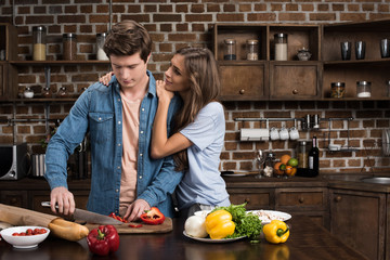 couple preparing dinner at home