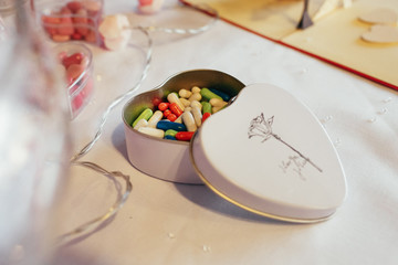 Colorful pills put in a steel box