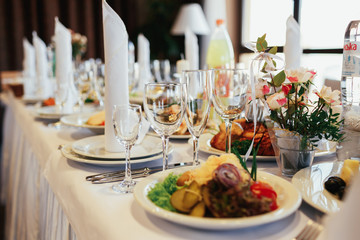 Empty glasses stand on rich dinner table