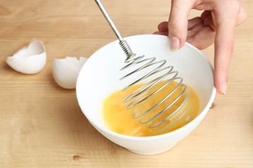 Broken chicken egg in a bowl