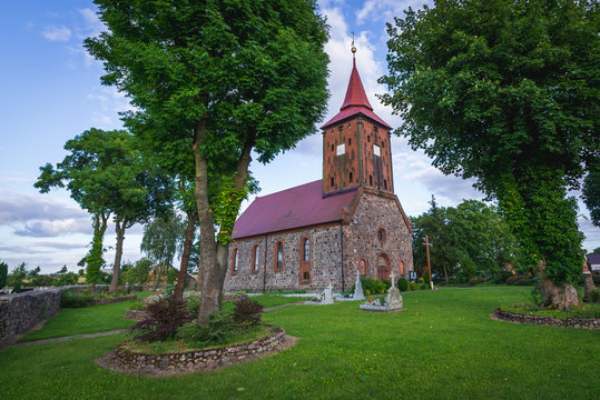 Red bricks and stones church in small village Zelechowo, West Pomerania region of Poland
