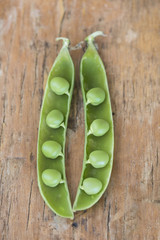 green peas in a wooden table