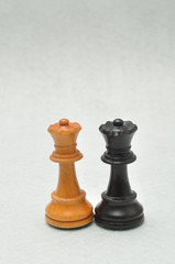 Queen chess pieces in white and black