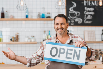 bartender with open signboard