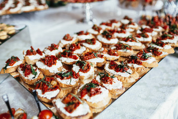 Breads with butter and red pepper served on a glass dish