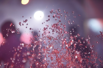 Multicolored spray fountain at night