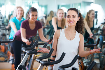 girl and other females working out in sport club