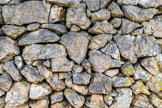 Stone rock fence or gabion wall texture.