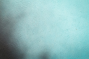Blue paint on a stone or concrete surface