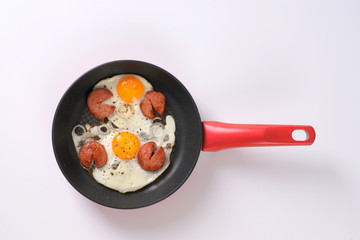 fried eggs with sausage