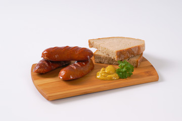 short thick sausages with bread